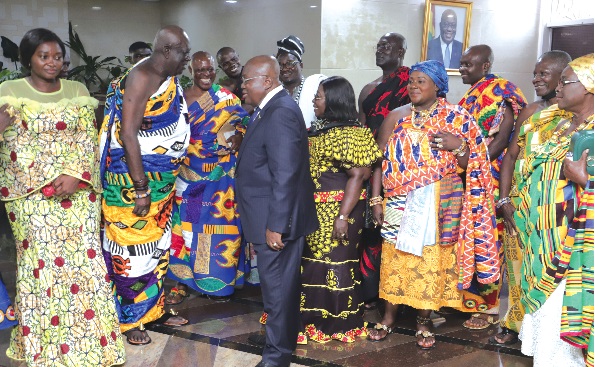 President Akufo-Addo interacting with Osabarimba Kwesi Atta II (2nd from left), Omanhen of the Oguaa Traditional Area. With them is Justina Marigold Assan (left), Central Regional Minister. Picture: SAMUEL TEI ADANO
